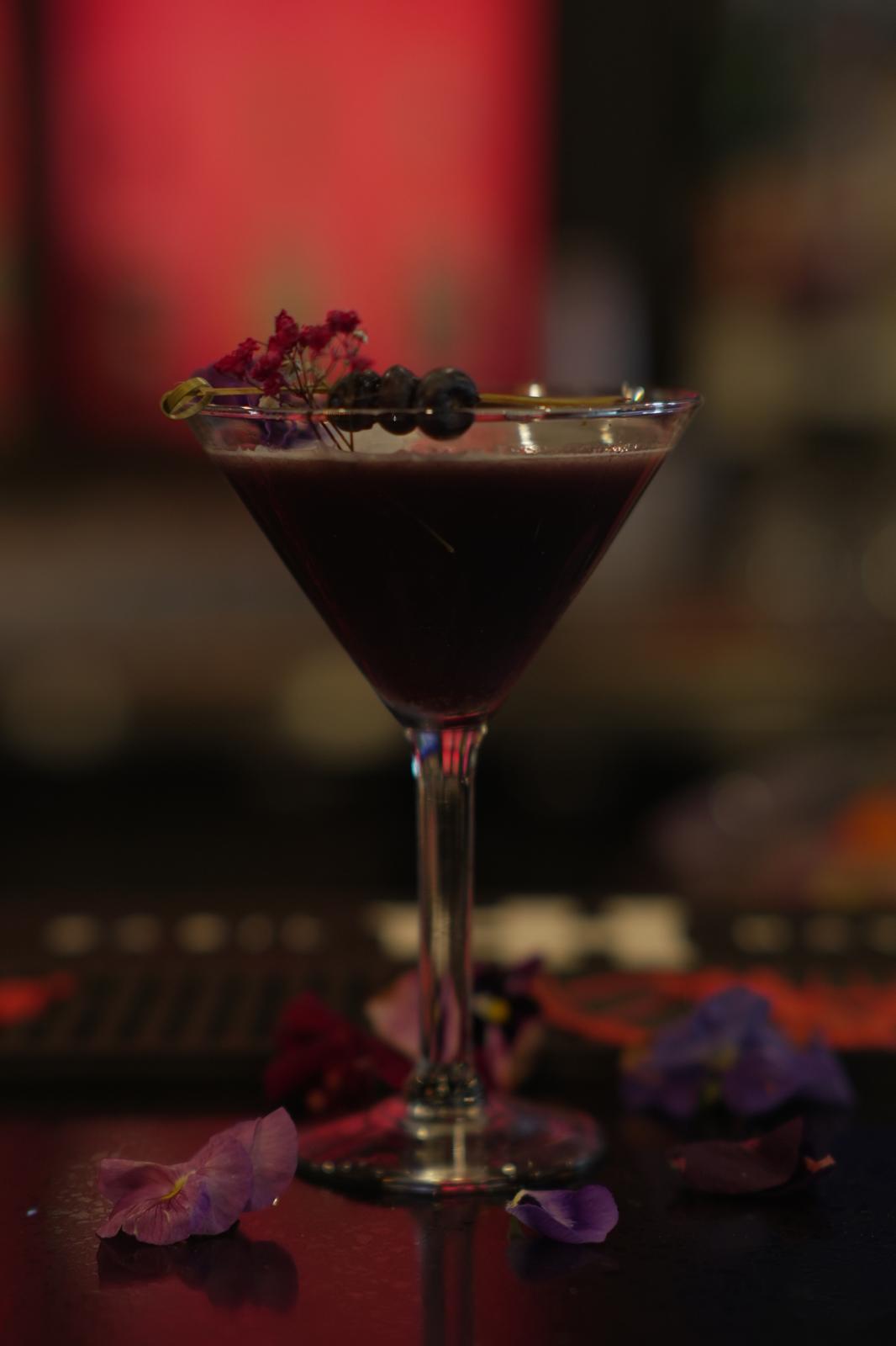 Berry Bliss martini garnished with berries and flowers